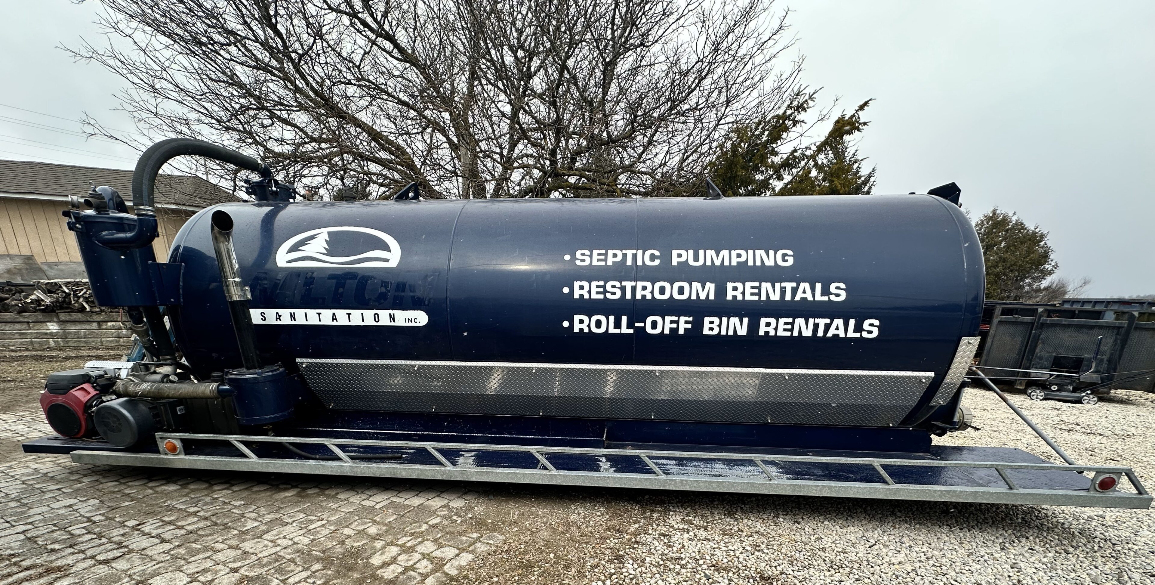A blue pipe sitting on top of the ground.